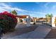 Welcoming pool entrance with desert landscaping and pergola, inviting residents to a serene and refreshing experience at 2842 E Beck Ln # 2, Phoenix, AZ 85032