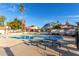 Beautiful community pool with lounging areas and umbrellas, surrounded by well-maintained landscaping and homes at 2842 E Beck Ln # 2, Phoenix, AZ 85032