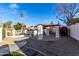 Community pool area with pergola, landscaping, and clear blue skies creating a relaxing outdoor space at 2842 E Beck Ln # 2, Phoenix, AZ 85032