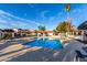 Community pool area featuring a large pool, shade structures, and ample seating for residents to enjoy at 2842 E Beck Ln # 2, Phoenix, AZ 85032