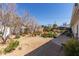 Large backyard with a mix of desert landscaping, trees, and patio area with outdoor seating at 2902 E Avalon Dr, Phoenix, AZ 85016