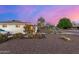 Single-story home with native desert landscaping and concrete walkway; view of the side of the property at 2902 E Avalon Dr, Phoenix, AZ 85016