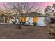 Exterior of a single-story home featuring desert landscaping under a colorful sky at 2902 E Avalon Dr, Phoenix, AZ 85016