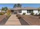 Quaint single story home with a well manicured front yard with desert landscaping at 2902 E Avalon Dr, Phoenix, AZ 85016