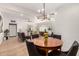 Open living space with tile flooring, neutral paint and combined living and dining areas at 2902 E Avalon Dr, Phoenix, AZ 85016