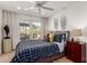 Comfortable bedroom with ceiling fan, patio access, and stylish decor at 2902 E Avalon Dr, Phoenix, AZ 85016