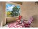 Cozy balcony with seating and a view of lush greenery at 2989 N 44Th St # 3016, Phoenix, AZ 85018