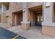 Brick apartment building entrance with modern lighting and secure entry system at 2989 N 44Th St # 3016, Phoenix, AZ 85018