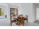 Charming dining area with seating for four and sliding glass doors to a balcony for an enjoyable experience at 2989 N 44Th St # 3016, Phoenix, AZ 85018