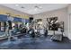 Bright gym space with weight machines, elliptical, and inspiring wall art at 2989 N 44Th St # 3016, Phoenix, AZ 85018