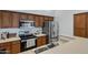 Well-equipped kitchen featuring stainless steel appliances, tile backsplash, and a breakfast bar at 2989 N 44Th St # 3016, Phoenix, AZ 85018