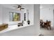 Open-concept living area with a ceiling fan that provides comfort and style with dining views at 2989 N 44Th St # 3016, Phoenix, AZ 85018