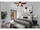 Serene main bedroom with balcony access, neutral decor, and contemporary bedside lamps at 2989 N 44Th St # 3016, Phoenix, AZ 85018