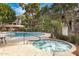 Relaxing community pool and spa area surrounded by mature trees for ultimate relaxation and enjoyment at 2989 N 44Th St # 3016, Phoenix, AZ 85018