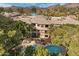 Aerial view of community pool and spa surrounded by lush landscaping at 2989 N 44Th St # 3016, Phoenix, AZ 85018
