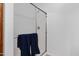 Modern shower stall with clear glass doors, silver hardware, and a blue towel at 2989 N 44Th St # 3016, Phoenix, AZ 85018