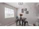 Cozy dining area with breakfast table, decorative wall art, and abundant natural light at 3402 N 32Nd St # 118, Phoenix, AZ 85018