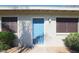 Charming front door with a fresh blue color and lush landscaping at 3402 N 32Nd St # 118, Phoenix, AZ 85018