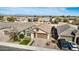 Stunning aerial view showcases a desirable neighborhood with tree-lined streets and well-kept homes at 35207 N Agua Caliente Rd, San Tan Valley, AZ 85144