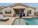 Relaxing backyard featuring a pristine pool, sun loungers, and a covered patio at 3563 E Austin Dr, Gilbert, AZ 85296