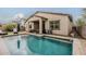 Beautiful backyard with a swimming pool, covered patio, and manicured landscaping at 3563 E Austin Dr, Gilbert, AZ 85296