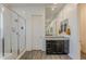 Modern bathroom showcasing a glass-enclosed shower and a sleek granite-topped vanity at 3563 E Austin Dr, Gilbert, AZ 85296
