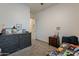 Bedroom featuring dresser, nightstand, decorative items, and neutral walls at 3563 E Austin Dr, Gilbert, AZ 85296