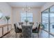 Inviting dining room featuring elegant furnishings and a view of the outdoor space with abundant natural light at 3563 E Austin Dr, Gilbert, AZ 85296