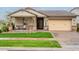 Inviting single-story home featuring a covered porch, stone accents, and a two-car garage at 3563 E Austin Dr, Gilbert, AZ 85296