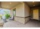 Inviting front porch featuring ample seating, stone accents, and a well-lit entry at 3563 E Austin Dr, Gilbert, AZ 85296