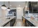Well-appointed kitchen featuring granite countertops, gas range, and stainless steel dishwasher at 3563 E Austin Dr, Gilbert, AZ 85296