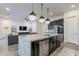 Stylish kitchen island with granite countertops, pendant lighting, and stainless steel appliances; a chef's dream at 3563 E Austin Dr, Gilbert, AZ 85296