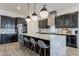 Modern kitchen with granite countertops, stainless steel appliances, and stylish pendant lighting at 3563 E Austin Dr, Gilbert, AZ 85296