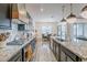 Bright kitchen showcasing granite counters, stainless appliances, and seamless flow into the dining space at 3563 E Austin Dr, Gilbert, AZ 85296
