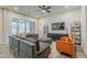 Spacious living room with a large sectional sofa, stylish decor, and sliding glass doors at 3563 E Austin Dr, Gilbert, AZ 85296