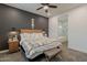 Relaxing main bedroom with a modern accent wall and ensuite bathroom at 3563 E Austin Dr, Gilbert, AZ 85296