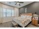 Stylish main bedroom featuring a king-size bed, accent wall, and modern decor at 3563 E Austin Dr, Gilbert, AZ 85296