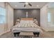 Comfortable main bedroom complete with accent wall, ample lighting, and a cozy bench at 3563 E Austin Dr, Gilbert, AZ 85296