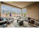Inviting covered patio with comfortable seating area and a view of the sparkling pool at 3563 E Austin Dr, Gilbert, AZ 85296