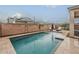 Stunning pool area surrounded by a block wall and stylish outdoor furniture at 3563 E Austin Dr, Gilbert, AZ 85296