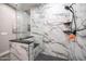 Marble shower featuring a built-in bench and glass enclosure, providing a spa-like experience at 40195 N Hailey Ln, Queen Creek, AZ 85140