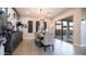 This dining room is brightly lit and features a decorative sideboard and a sliding glass door to the backyard at 40195 N Hailey Ln, Queen Creek, AZ 85140