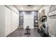 Spacious exercise room featuring a bench, sliding door closet, and cardio machine at 40195 N Hailey Ln, Queen Creek, AZ 85140