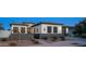 Charming single-story home with modern design elements and a neatly landscaped front at 40195 N Hailey Ln, Queen Creek, AZ 85140