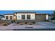 Beautiful home exterior with a well-manicured front yard and a two-car garage at 40195 N Hailey Ln, Queen Creek, AZ 85140