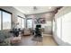 Sunlit home office featuring a modern desk, comfortable seating, and ample storage at 40195 N Hailey Ln, Queen Creek, AZ 85140