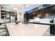 This spacious kitchen features black cabinetry, stainless appliances, and a large island with a white countertop at 40195 N Hailey Ln, Queen Creek, AZ 85140