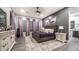 Spacious main bedroom featuring elegant decor, plush carpet, and plenty of natural light at 40195 N Hailey Ln, Queen Creek, AZ 85140
