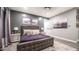 Comfortable main bedroom showcasing a luxurious bed, side tables, and fashionable decor at 40195 N Hailey Ln, Queen Creek, AZ 85140