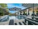 Stunning pool and patio area offering a perfect blend of relaxation and entertainment with covered seating and meticulous landscaping at 40195 N Hailey Ln, Queen Creek, AZ 85140